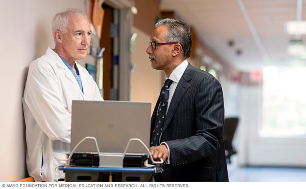 Heart specialists discussing a patient's situation