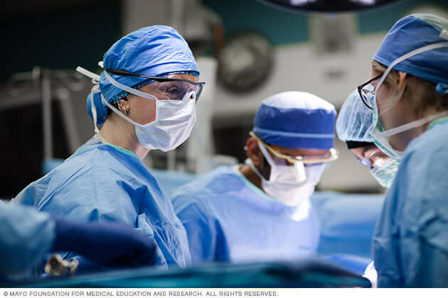 Surgeons working together in an operating room.